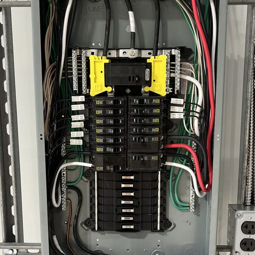 Residential load center with the dead front removed, breakers labeled and conductors dressed